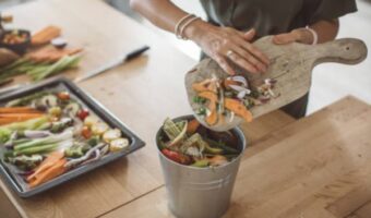 a woman prepares raw food in the kitchen