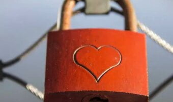 A padlock on the fence in memory of eternal love